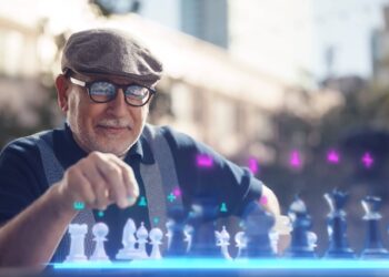 Meta vision - an old Man using AR Glasses to play chess