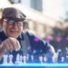 Meta vision - an old Man using AR Glasses to play chess