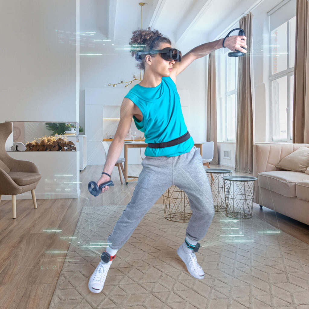 Person playing VR with VIVE Ultimate Trackers